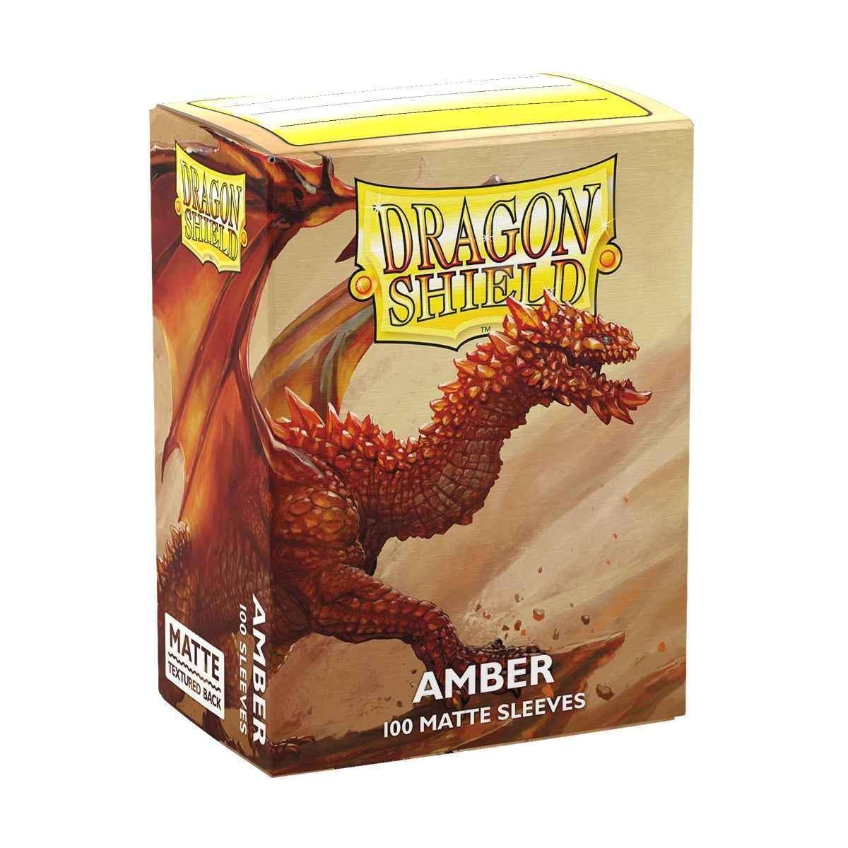 Schachtel mit Dragon Shield Kartenhüllen mit einem roten Drachenbild, beschriftet mit „Amber, 100 Matte Sleeves