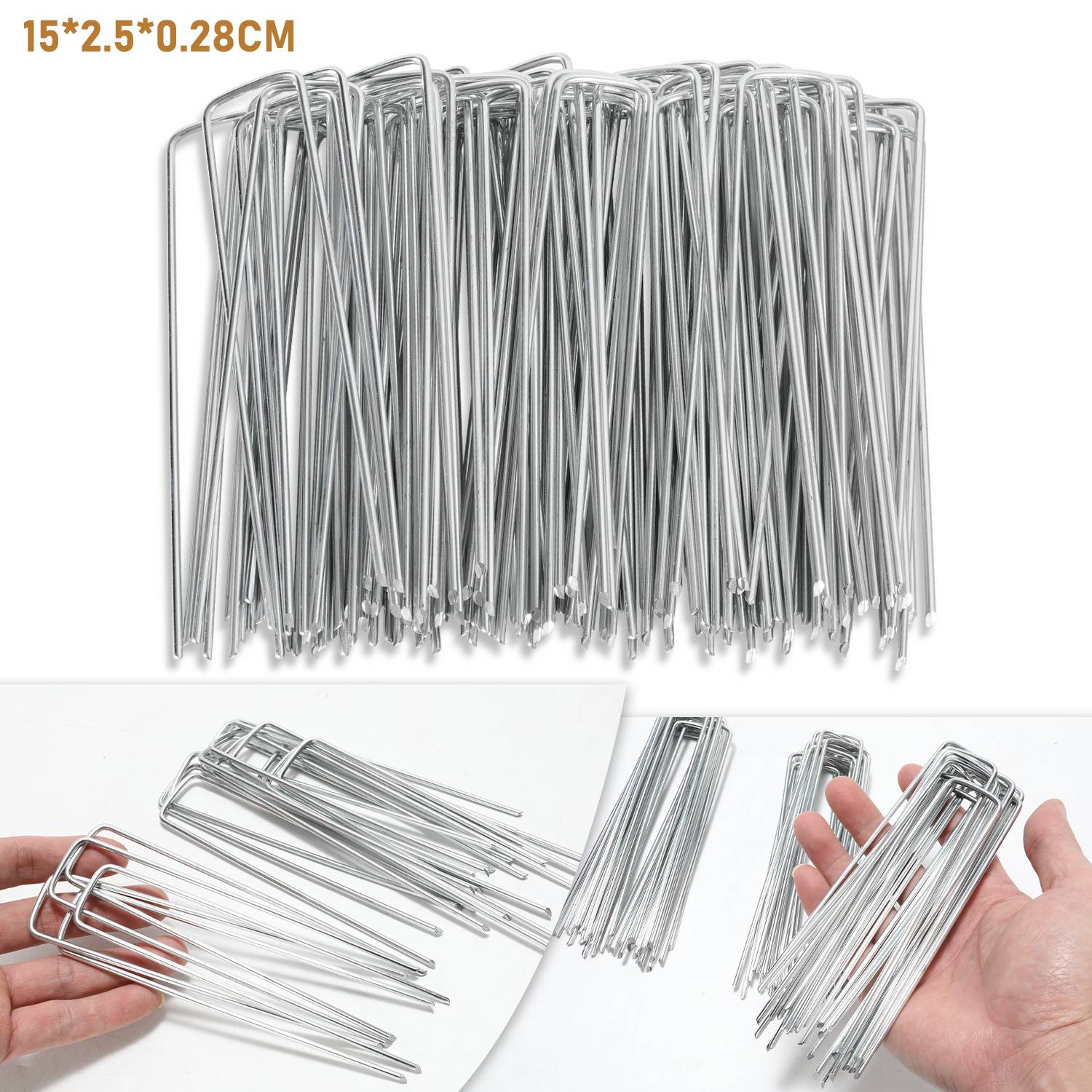 Eine Sammlung von Metall-Landschaftsbefestigungsstiften. Eine Hand, die mehrere Stifte hält und die Größe zeigt. Abmessungen angegeben: 15*2,5*0,28CM.