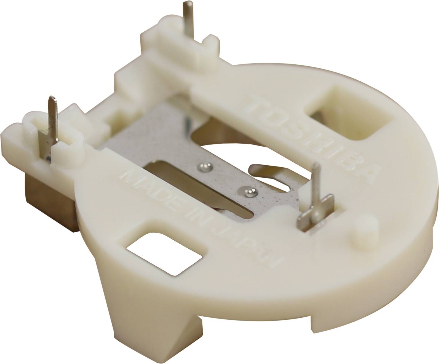 Rundes weißes Kunststoffteil mit Metallverbindern, beschriftet mit „Toshiba Made in Japan