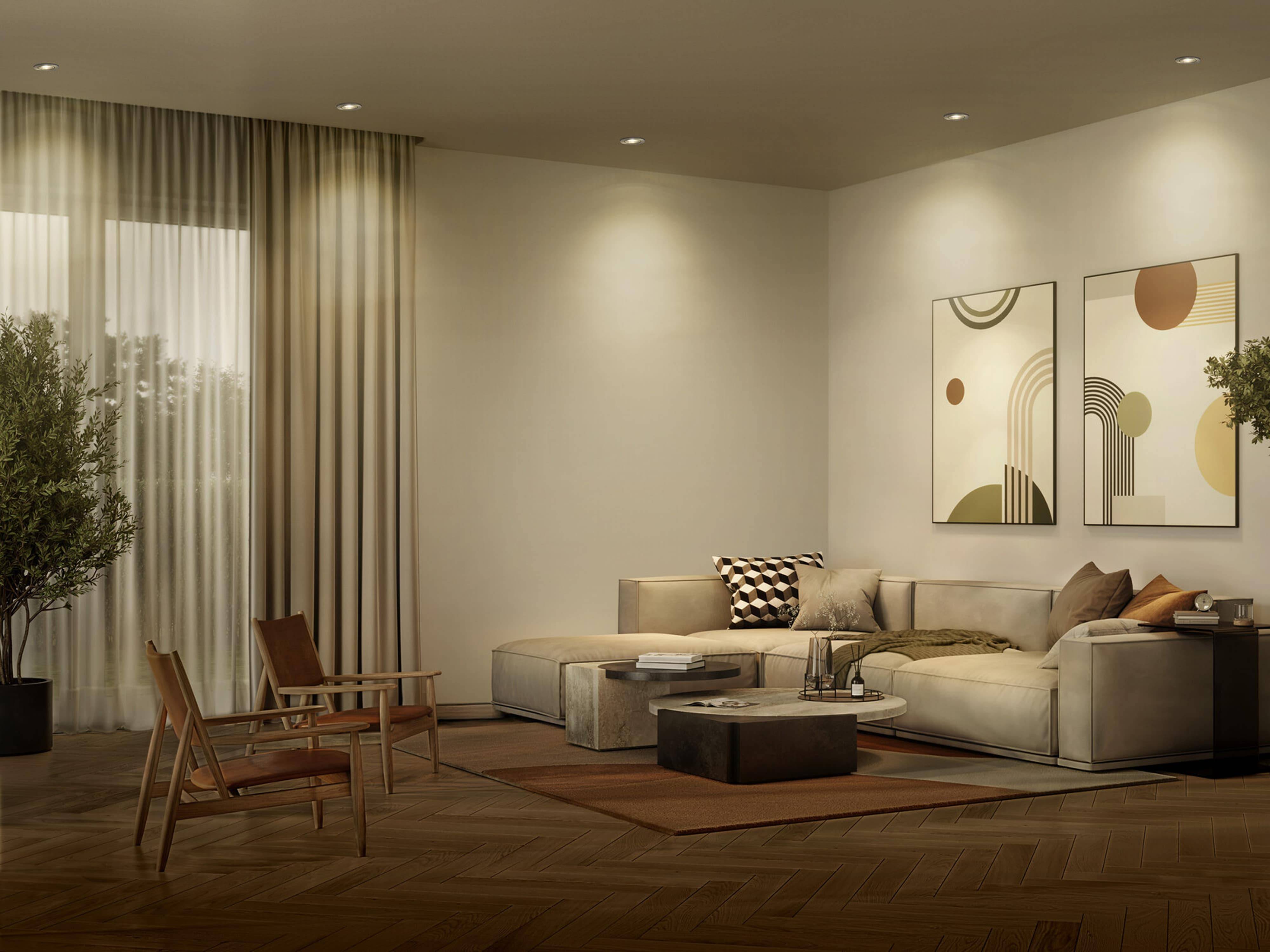 Ein modernes Wohnzimmer in neutralen Tönen mit einem großen beige Ecksofa, abstrakter Kunst an den Wänden und einem quadratischen Couchtisch.