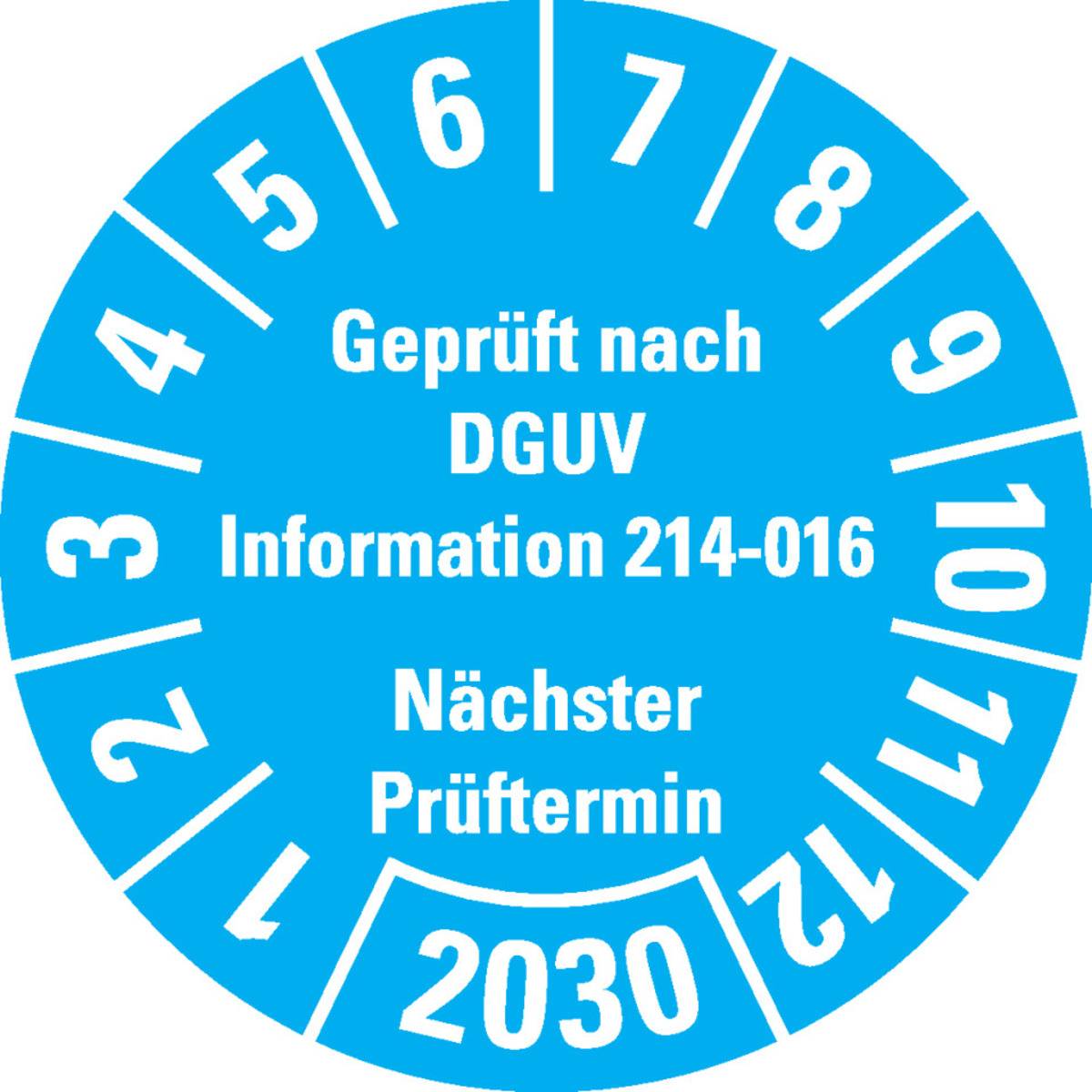 Das Bild zeigt ein blaues rundes DGUV-Prüfplakette mit den Nummern 1 bis 12 am Rand angeordnet und gibt an, dass die nächste Prüfung 2030 fällig ist.