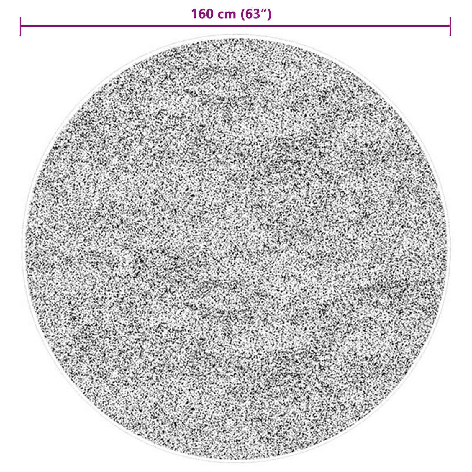 Ein runder Teppich mit einem gesprenkelten Schwarz-Weiß-Muster mit einem Durchmesser von 160 cm (63 Zoll).