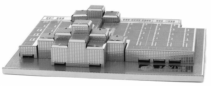 Ein Graustufen-Modell einer Stadtlandschaft mit mehreren rechteckigen Gebäuden, die auf einem Raster angeordnet sind und ein Stadtplanungslayout darstellen.
