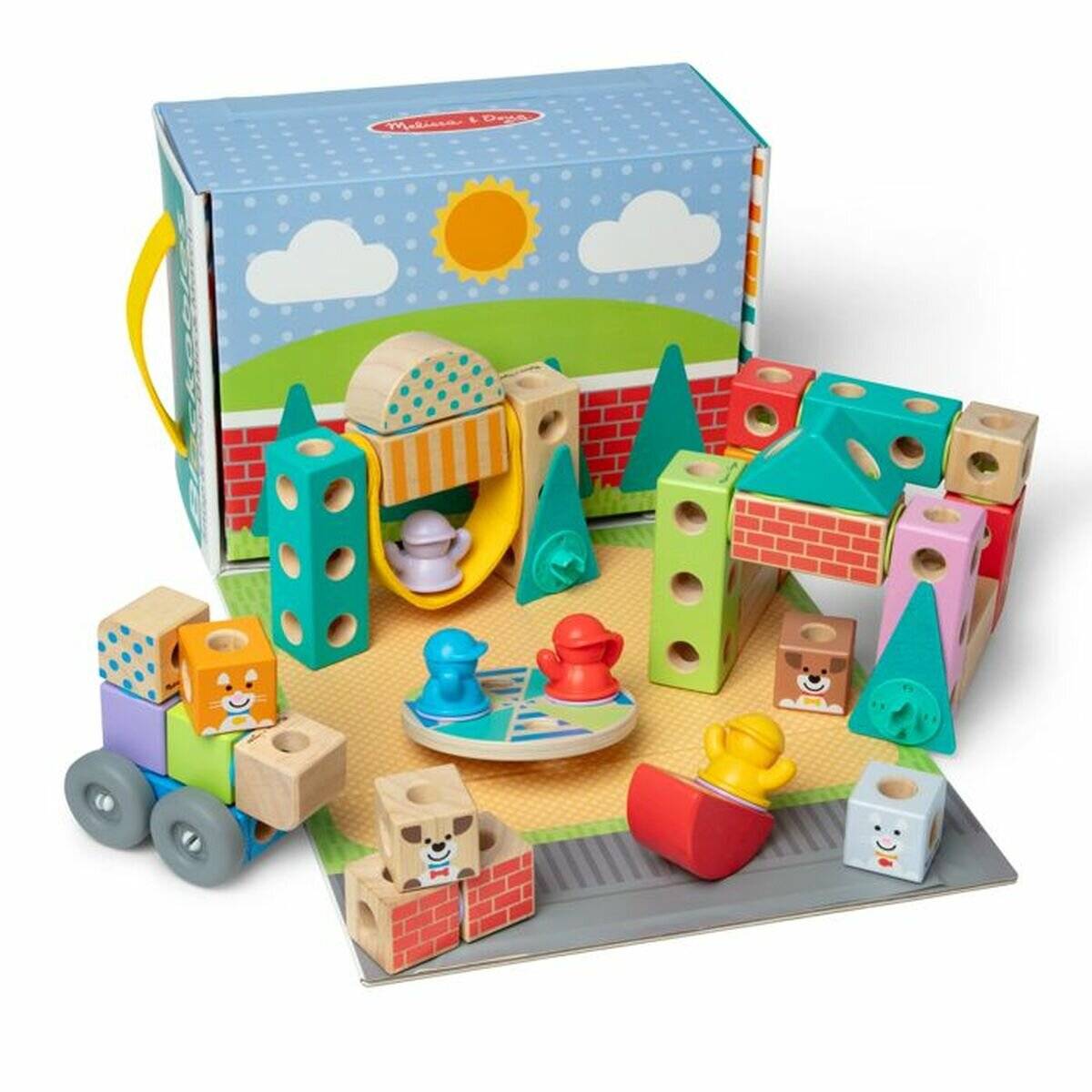 Spielzeugset mit bunten Holzblöcken und Figuren, einschließlich eines Zugs, Bäumen und geometrischen Formen auf einer Spielmatte mit hellem Hintergrund.