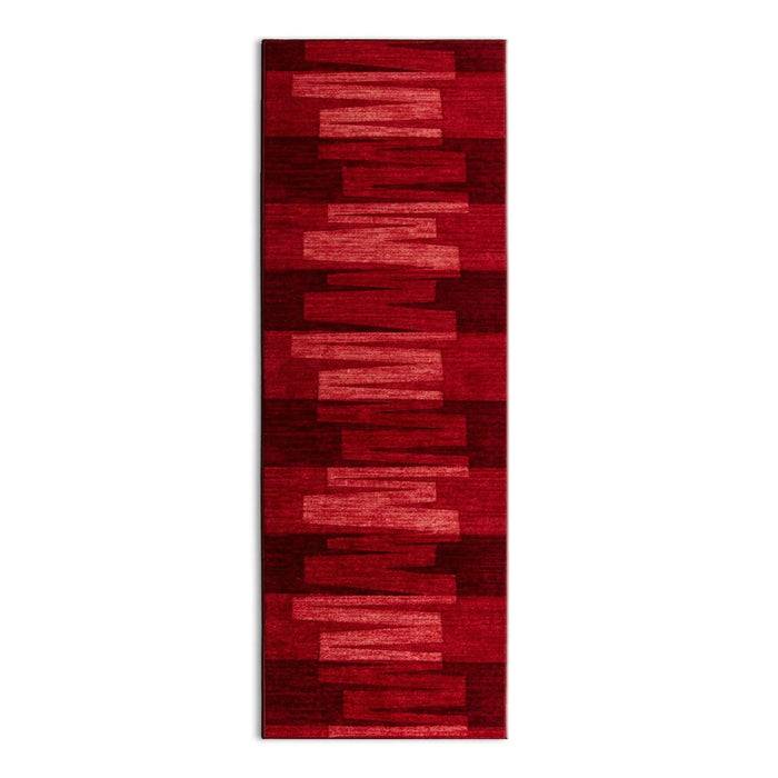 Rechteckiger roter Teppich mit unterschiedlichen Farbtonabstufungen, die ein modernes geometrisches Muster erzeugen.