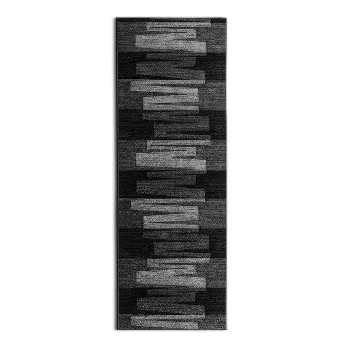 Rechteckiger schwarz-grauer Bereich Teppich mit einem linearen, geometrischen Muster, das abwechselnde helle und dunkle rechteckige Blöcke aufweist.