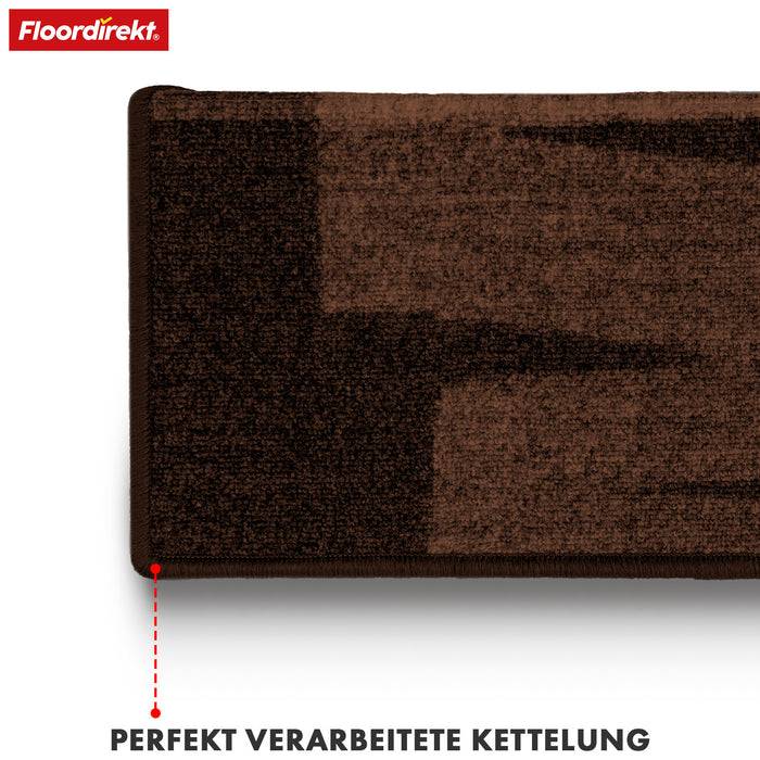 Rechteckiger Teppich mit einem braun- und beigefarbenen Verlaufsmuster. Mit der Bezeichnung „perfekt verarbeitete Kettelung