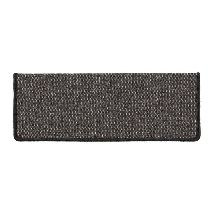 Eine dunkelgraue rechteckige Stoff-Fußmatte mit gesprenkeltem Muster und schwarzem Rand.