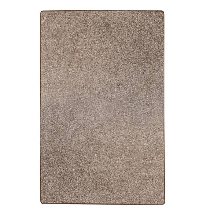 Ein rechteckiger beiger Teppich mit strukturiertem Muster.