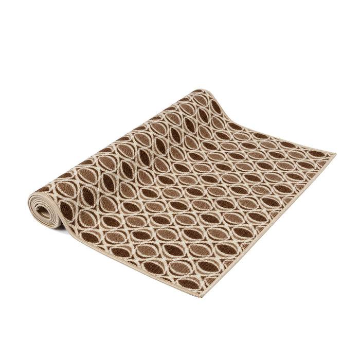Eine beige und braune Yogamatte ist ausgerollt und zeigt ein geometrisches Muster aus ineinander verschlungenen Kreisen.