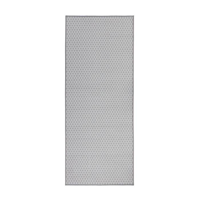 Ein rechteckiger grauer Teppich mit einem subtilen Rautenmuster durchgehend.
