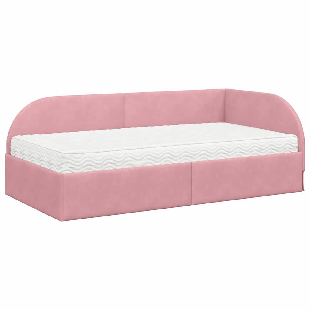 Ein rosa gepolstertes Tagesbett mit weißer Matratze, mit abgerundeter Rückenlehne und Stauraum darunter.