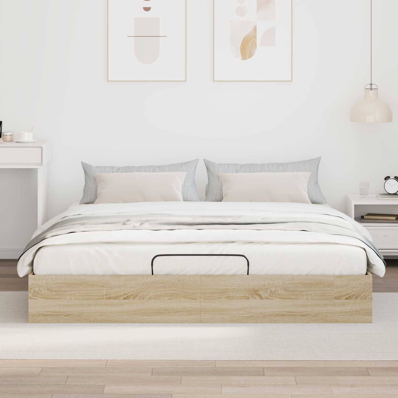 Ein minimalistisches Schlafzimmer mit einem Holzbett, weißer Bettwäsche und grauen Kissen. Zwei abstrakte Kunstrahmen hängen über dem Bett, und eine Pendelleuchte befindet sich auf der rechten Seite.