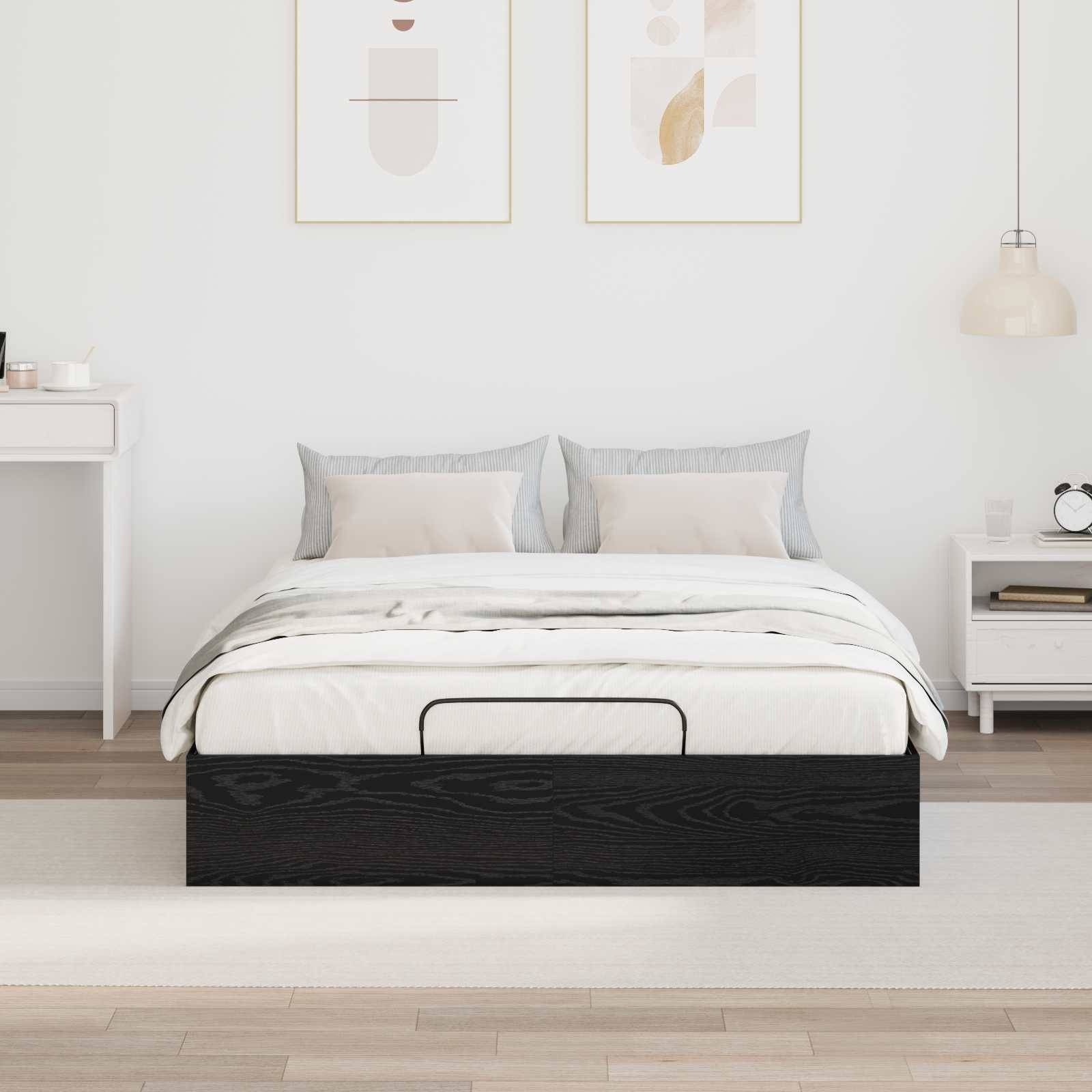 Modernes Schlafzimmer mit einem dunklen Holzbett, weiß-grauer Bettwäsche, minimalistischen Bildern in Rahmen an der Wand und einem kleinen Nachttisch.