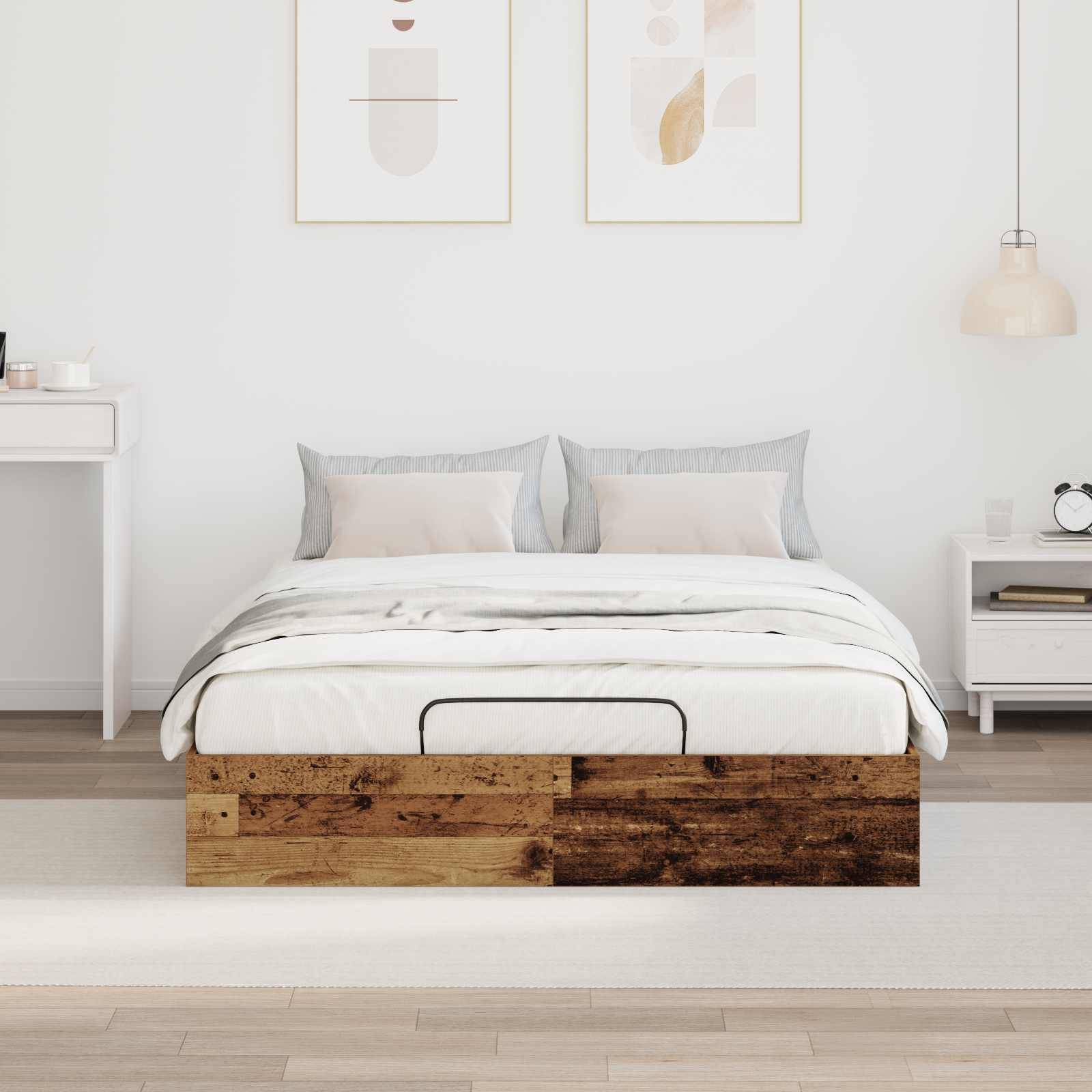 Ein minimalistisches Schlafzimmer mit einem Holzbett, grauer und weißer Bettwäsche, zwei kleinen gerahmten abstrakten Kunstwerken darüber und einem einfachen Nachttisch.