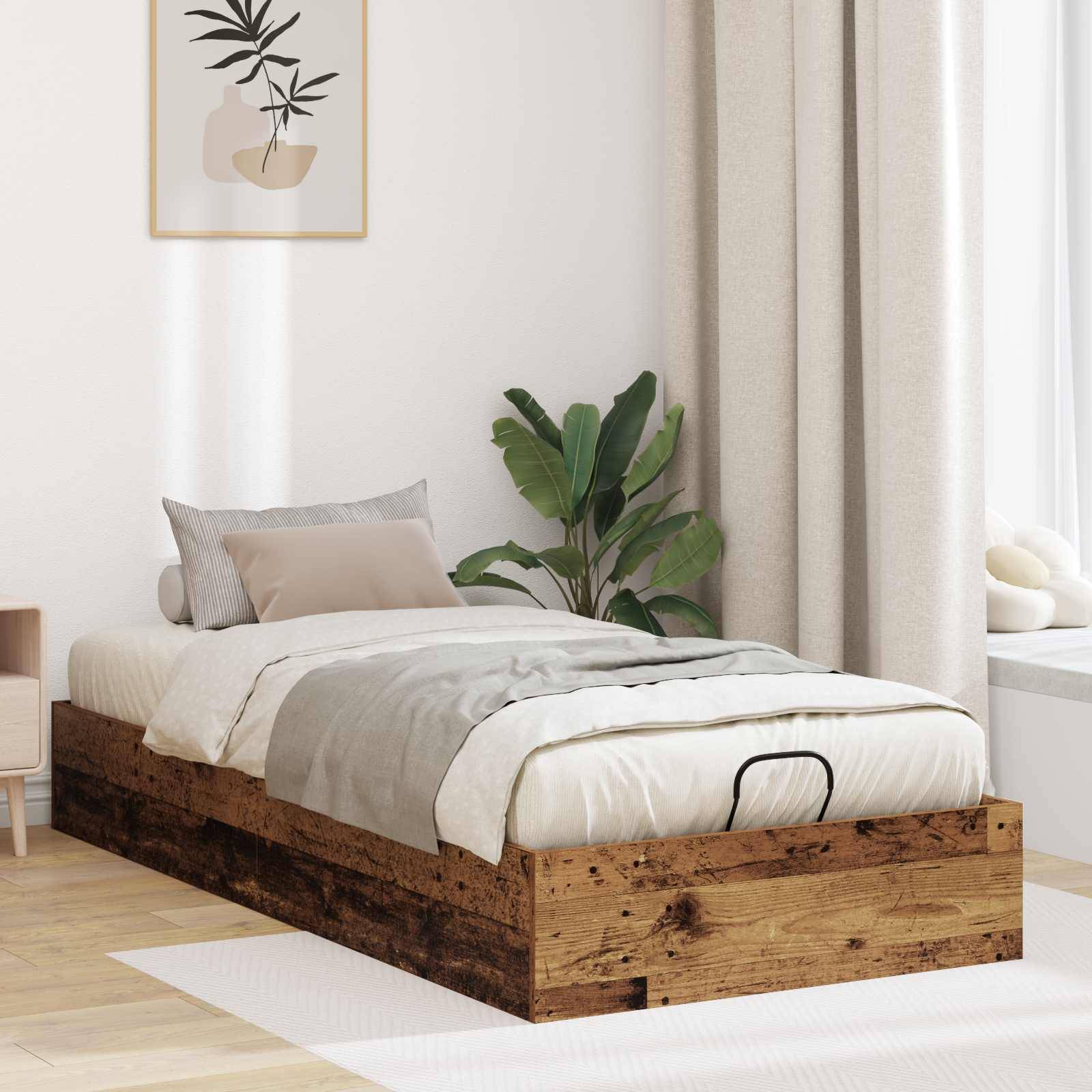 Ein minimalistisches Schlafzimmer mit einem Holz-Podestbett, grauer Bettwäsche, einer Pflanze in der Ecke und einem gerahmten abstrakten Kunstwerk an der Wand.