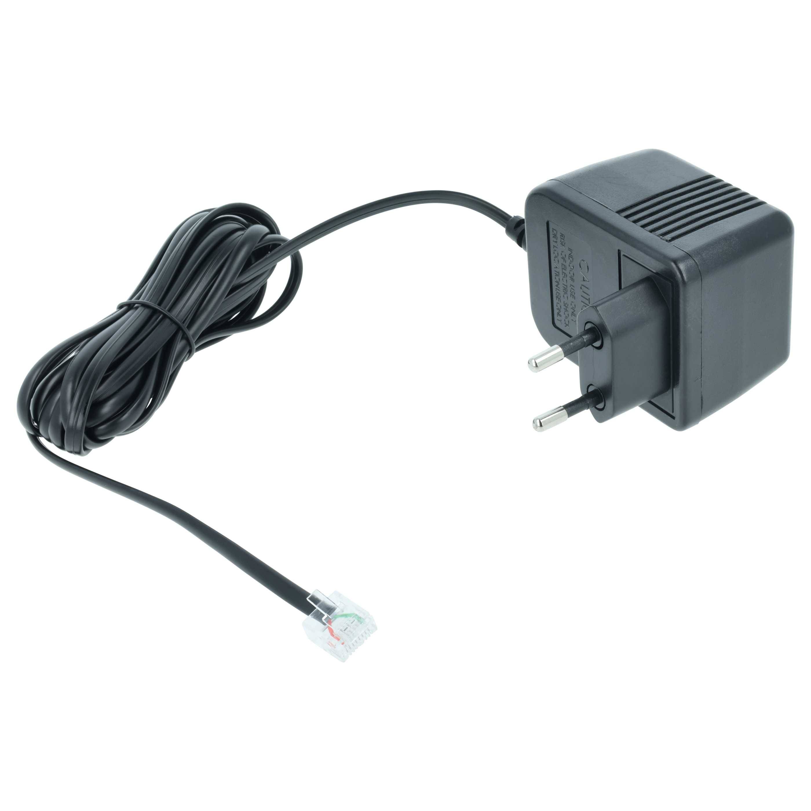 Ein schwarzer Stromadapter mit zwei runden Stiften und einem angeschlossenen langen Kabel, das in einen Stecker endet und zum Stromversorgung von elektronischen Geräten ausgelegt ist.