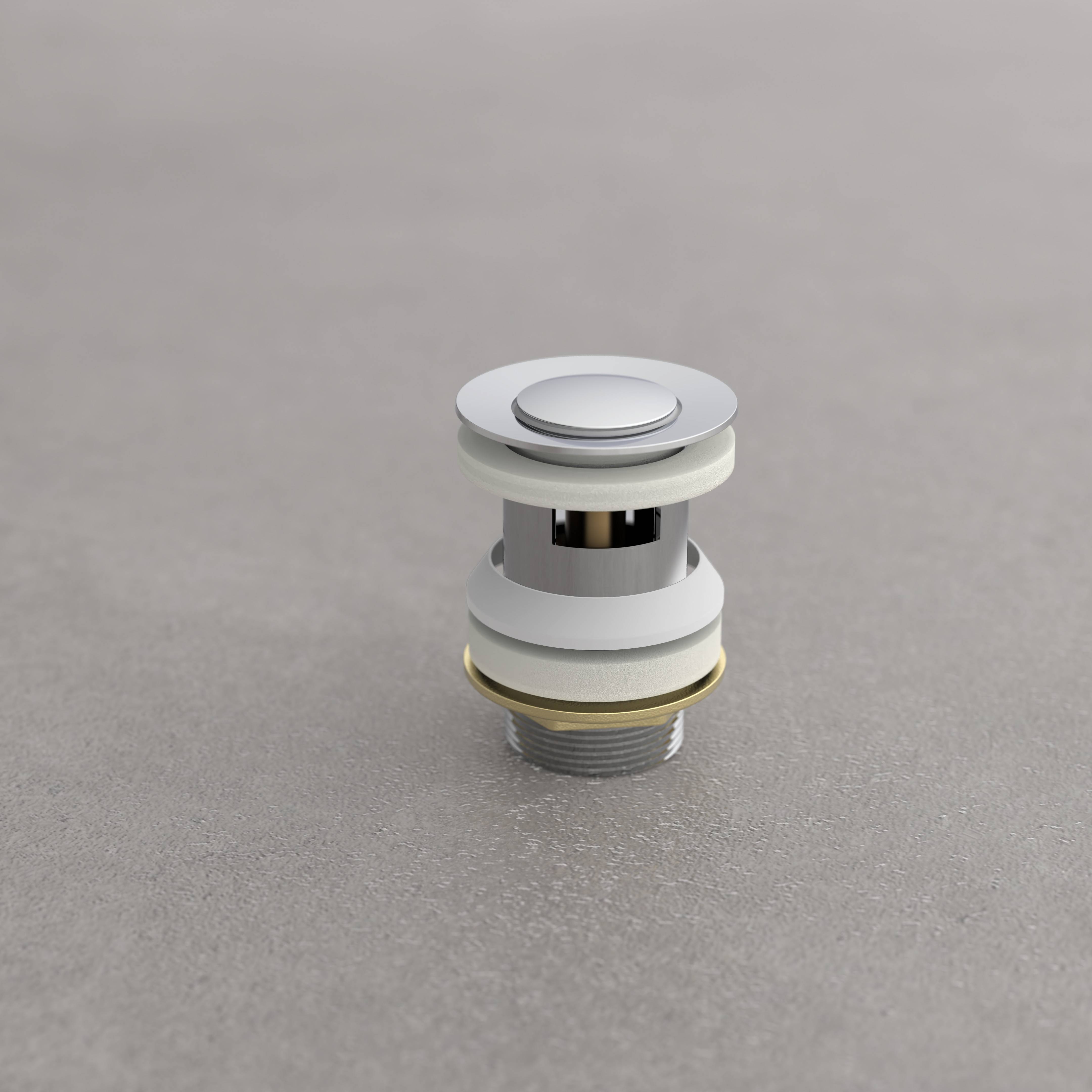 Ein metallischer Druckknopf-Abflussventil auf einer grauen Oberfläche, das sein zylindrisches Design und die silberne Oberfläche zur Schau stellt.