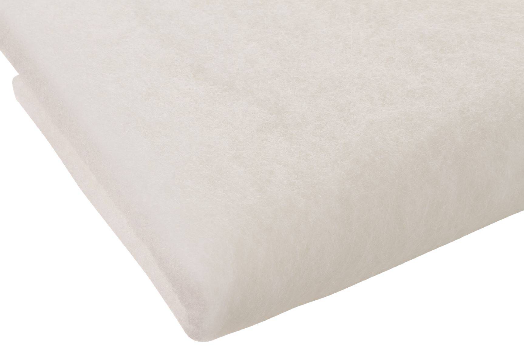 Eine Nahaufnahme eines hellbeigen rechteckigen Kissens mit glatter, weicher Textur, das den gesamten Bildrahmen ausfüllt.