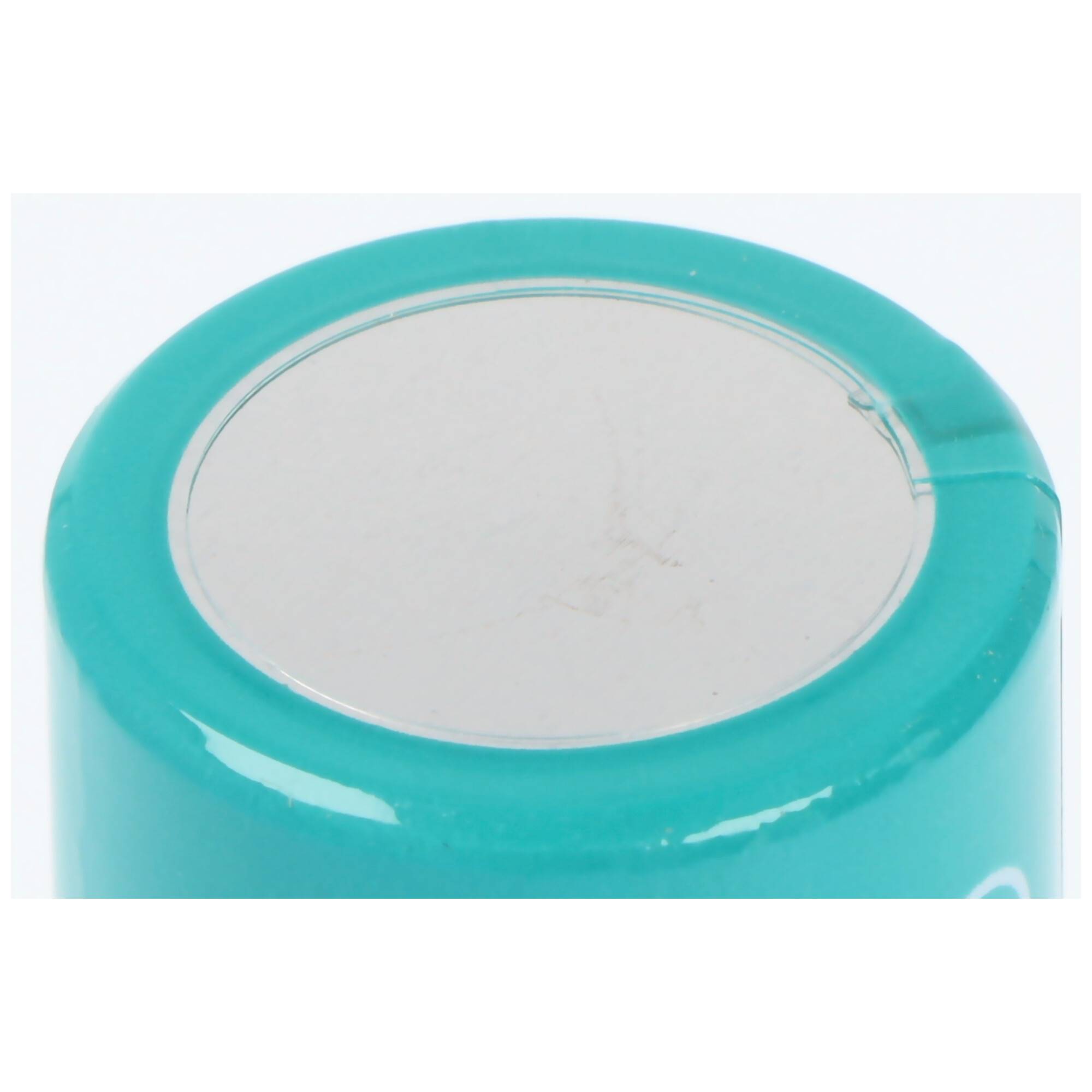 „Draufsicht auf ein türkisfarbenes zylindrisches Objekt mit einer glatten, flachen grauen Oberfläche. Das Objekt hat einen glänzenden Oberflächenfinish.