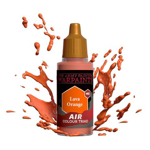 Eine Flasche Warpaints Air Color Triad in Lava Orange Mitteltönung mit orangefarbenen Farbspritzern darum herum.