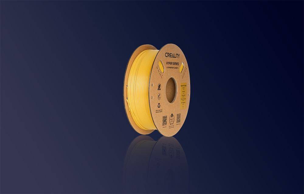 Eine Spule mit gelbem Filament mit der Aufschrift „Creality Hyper Series