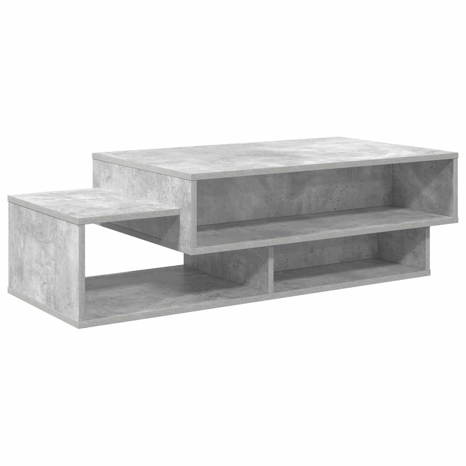 Ein moderner, grauer Betoncouchtisch mit zwei Ebenen und einem offenen Regal zur Aufbewahrung, im minimalistischen Stil gestaltet.