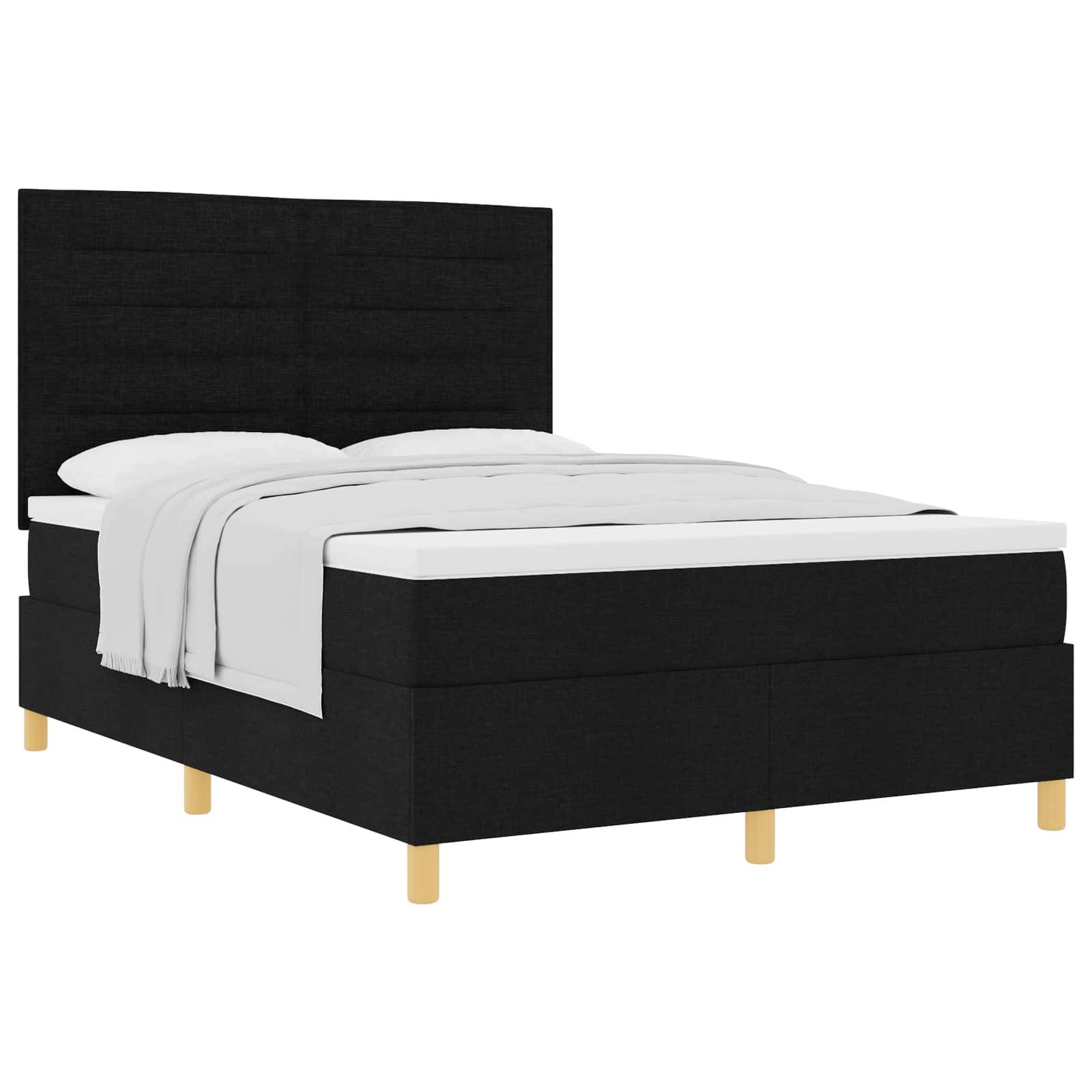 Ein modernes, schwarz gepolstertes Bett mit einer weißen Matratze und weißer Bettwäsche, ausgestattet mit einem gesteppten Kopfteil und Holzbeinen.