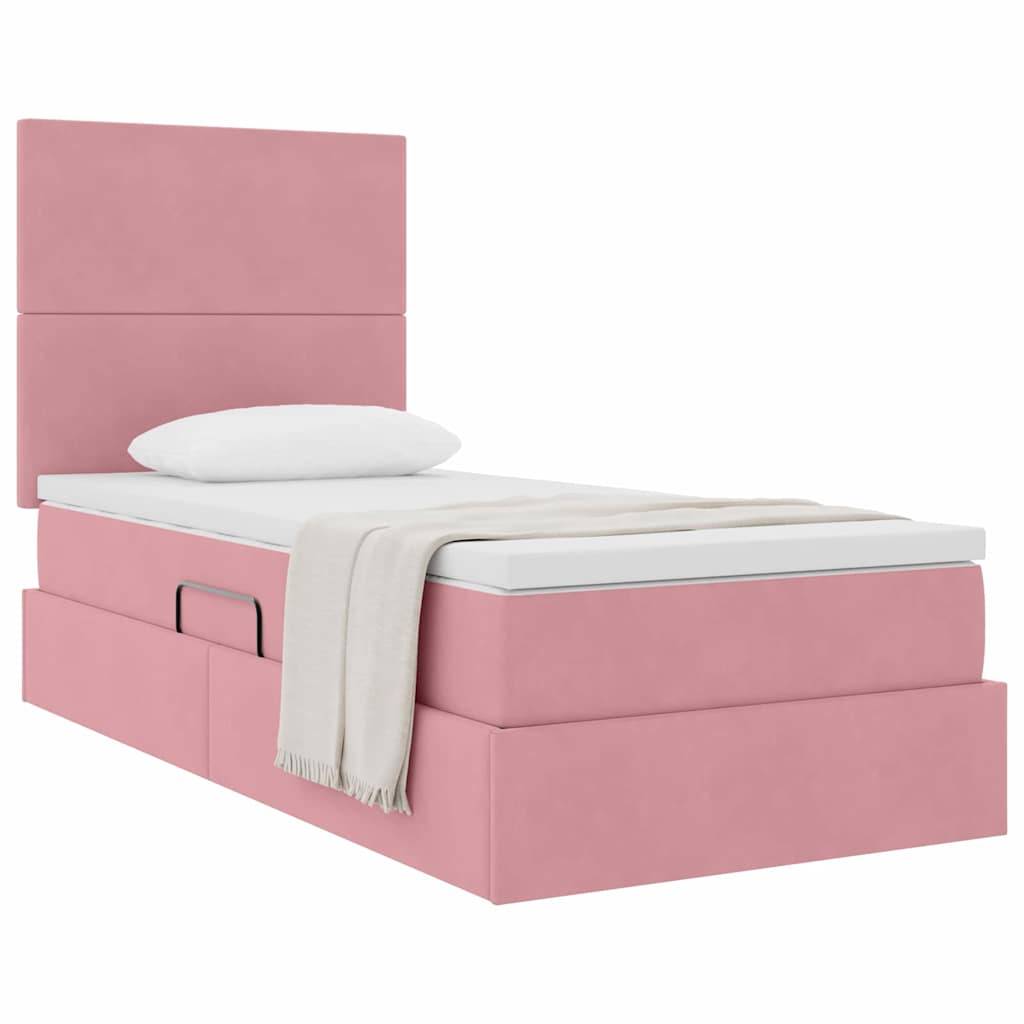 Ein rosa Doppelplattformbett mit Kopfteil, weiße Bettwäsche, eine gefaltete beige Decke am Fußende und drei Schubladen zur Aufbewahrung an der Seite.