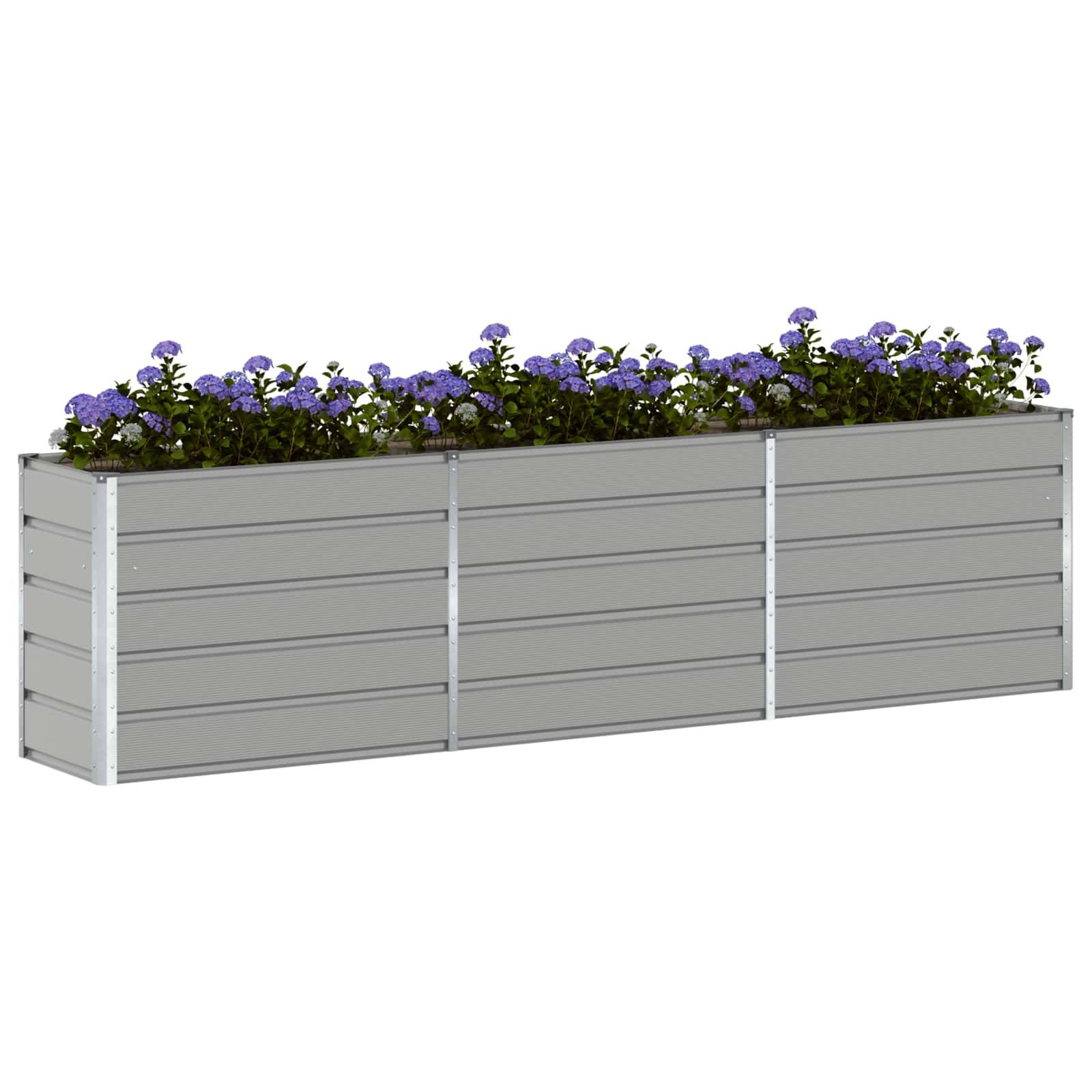 Großer grauer rechteckiger Blumenkübel mit lebendigen violetten Blüten oben, geeignet für Außengärtnerei oder dekorative Zwecke.