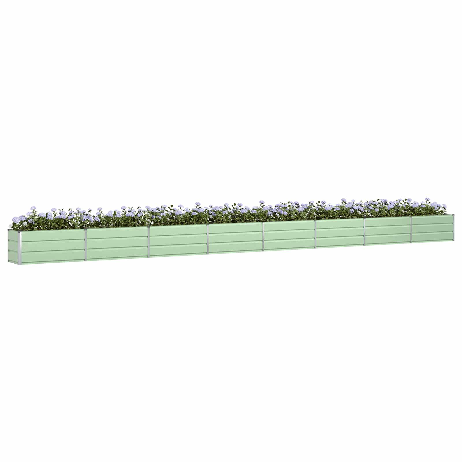 Ein langer, hellgrüner rechteckiger Blumenkasten gefüllt mit kleinen weißen Blüten und Grünpflanzen, von der Seite betrachtet.