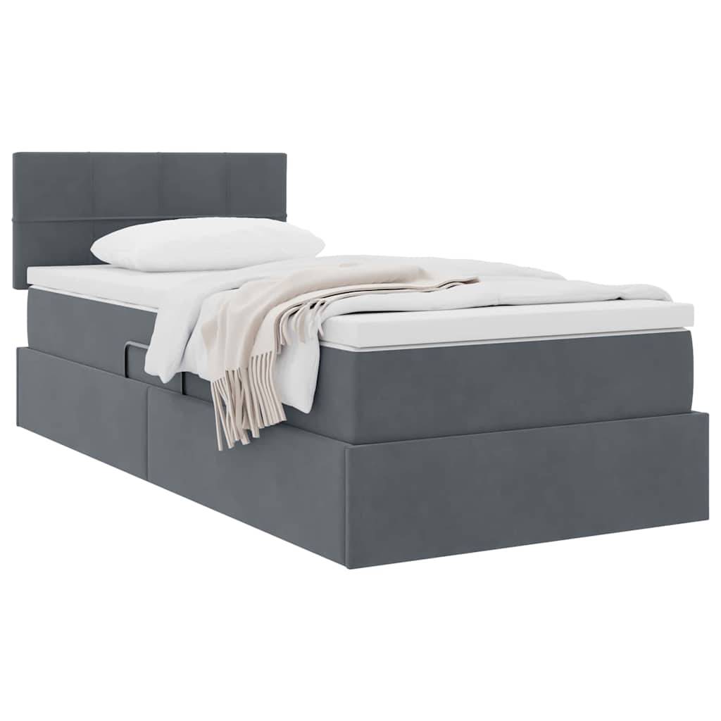 Ein grau gepolstertes Bett mit weißem Kissen und beige Decke sauber gefaltet. Das Bett hat ein modernes Design mit einem hohen Kopfteil.