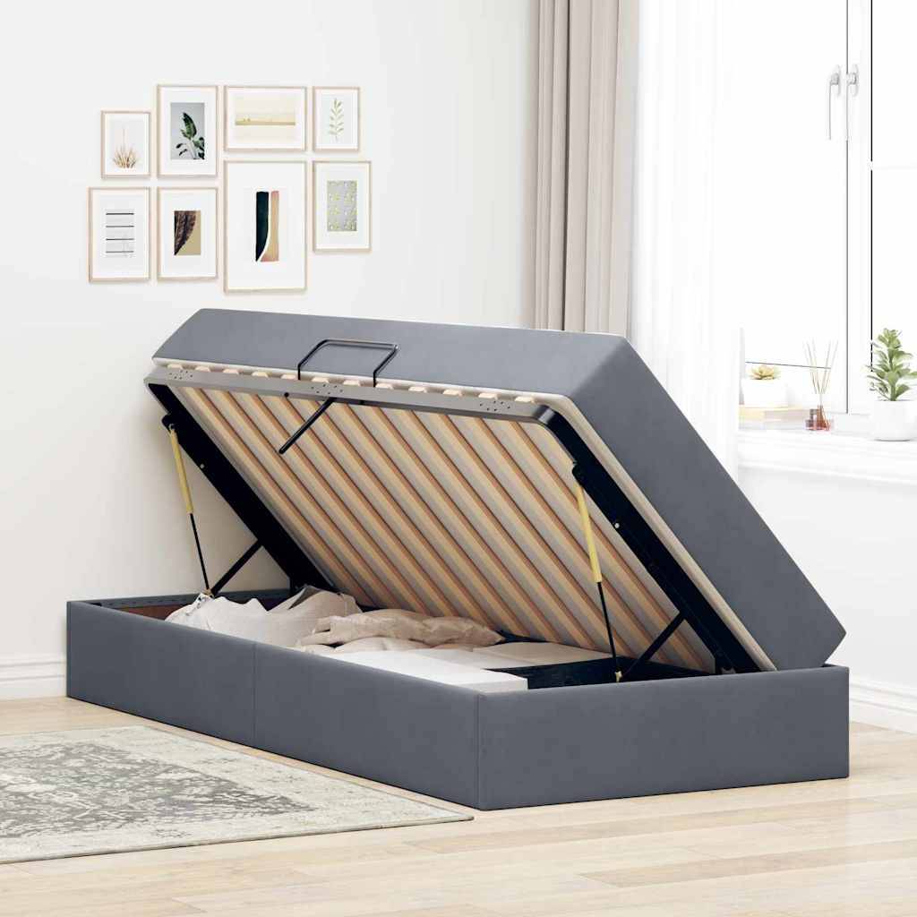 Ein modernes Schlafzimmer mit einem schwarzweißen Bett mit blauer Unterbeleuchtung, zwei abstrakten Wandkunstwerken und einer Nachttischlampe auf einem Tisch.