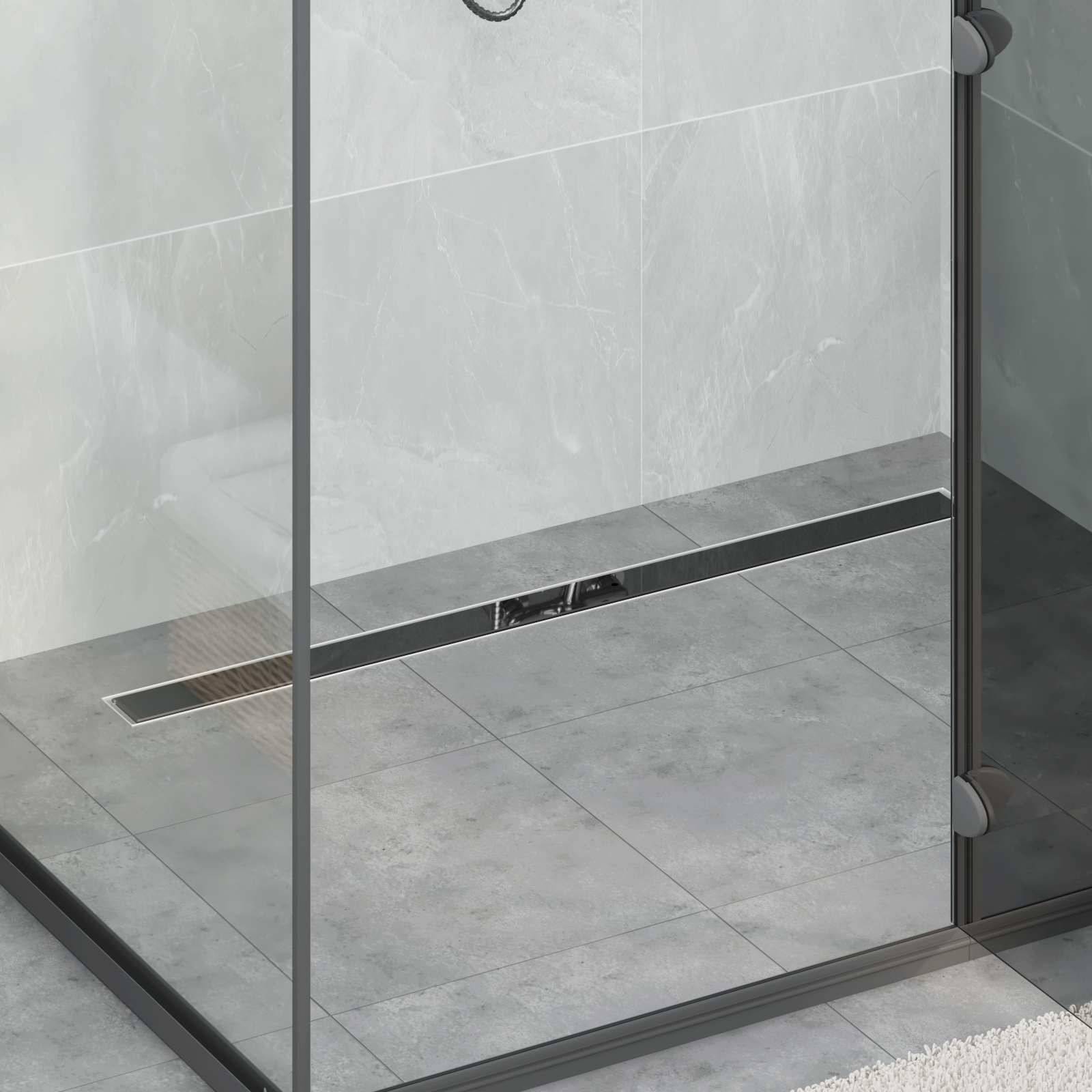 Modernes Badezimmer mit schlankem Glasgehäuse und schwarzem Rahmen, mit minimalistischem Fliesendesign und einem linearen Ablauf auf dem Boden.