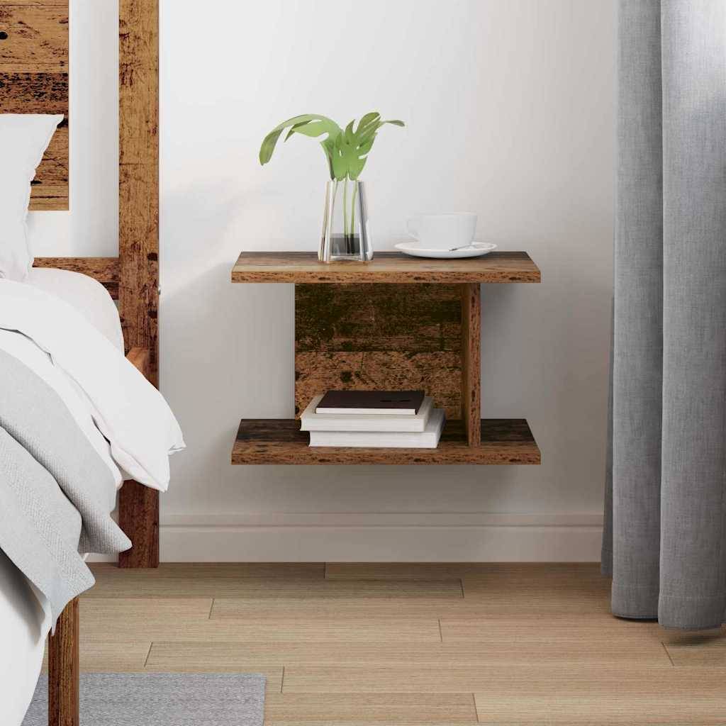 Ein minimalistisches Schlafzimmer mit einem weißen Bett, grauen Kissen und einer neutralen Tagesdecke. Zwei schwebende Nachttische mit Dekoration flankieren das Bett.