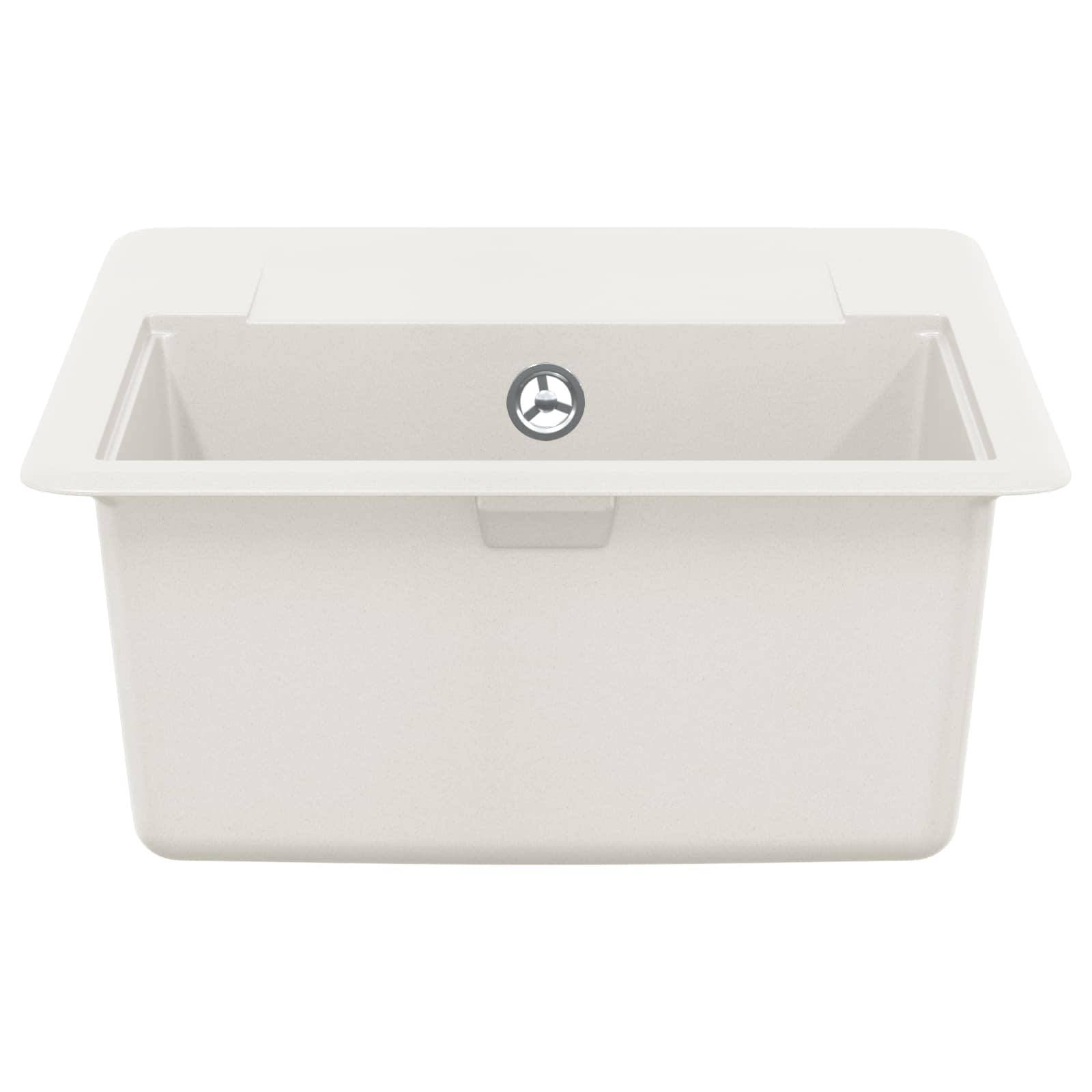 Ein weißes rechteckiges Spülbecken mit einem zentralen Abflussloch von oben betrachtet.