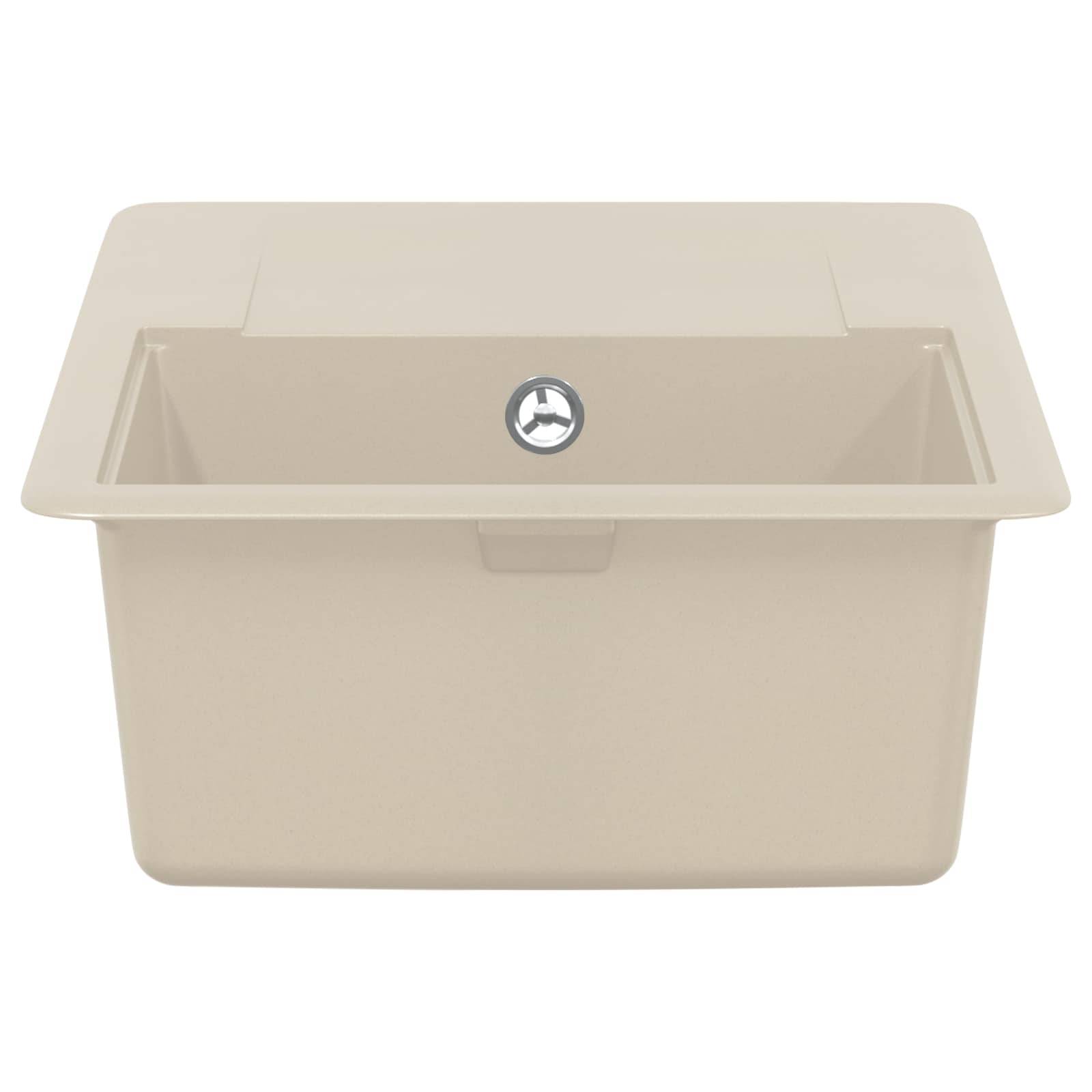 Ein beige rechteckiges Küchenspülbecken mit einer einzelnen Ablauföffnung in der Mitte des Beckens.