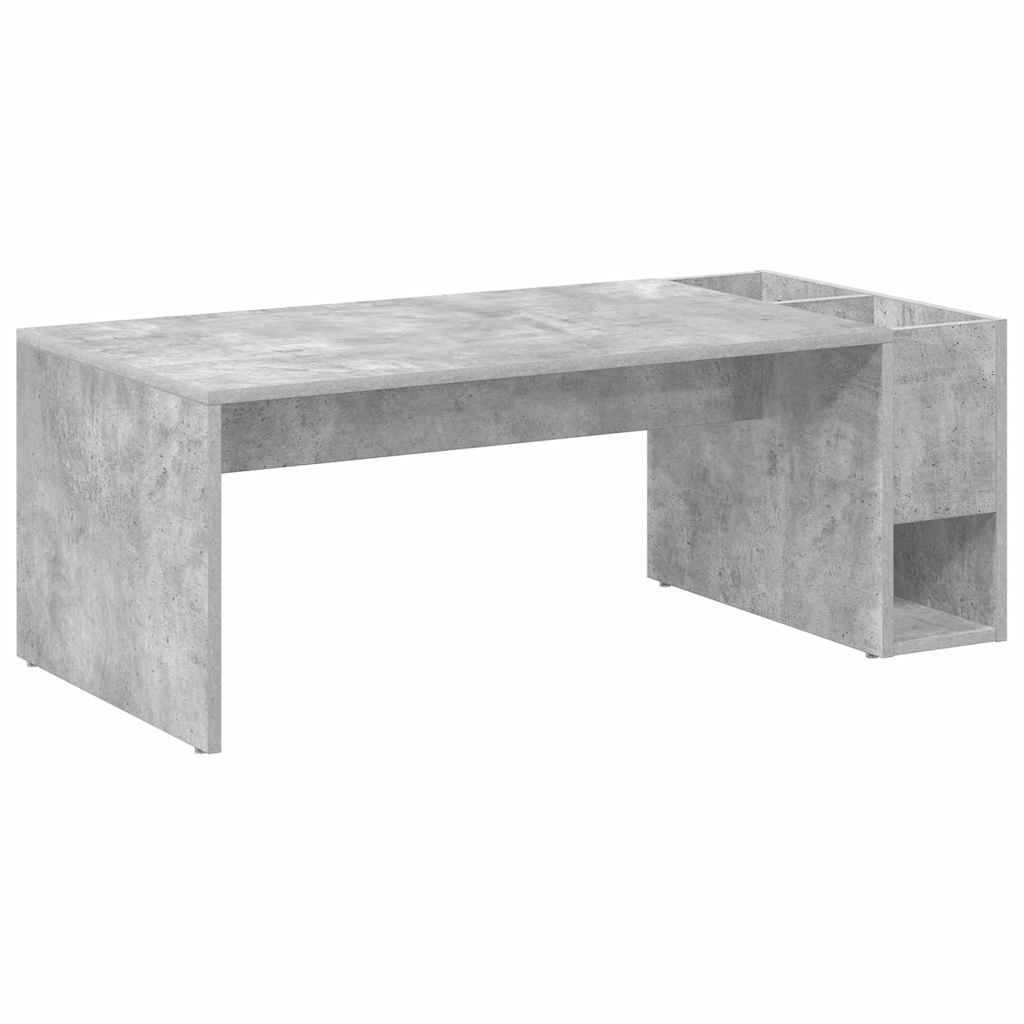 Ein moderner, minimalistischer grauer Betonschreibtisch mit glatter Oberfläche und integrierten Stauraumbehältern auf der rechten Seite.