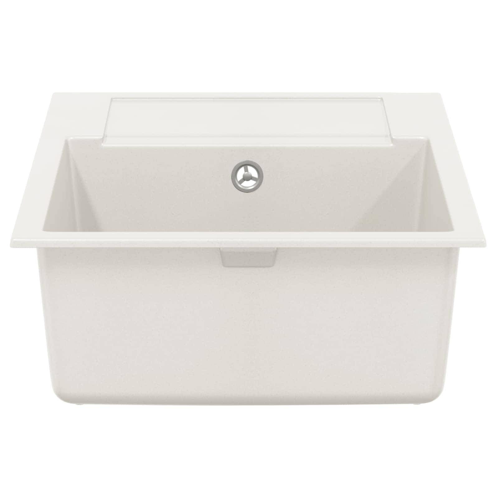 Ein weißes rechteckiges Spülbecken mit einem einzelnen Ablauf in der Mitte, von oben betrachtet.
