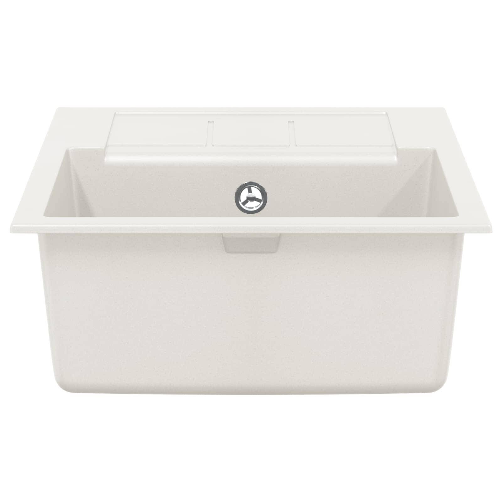 Ein weißes Küchenspülbecken mit quadratischem Becken und integriertem Abtropfbrett, mit zentralem Ablaufloch, von oben betrachtet.