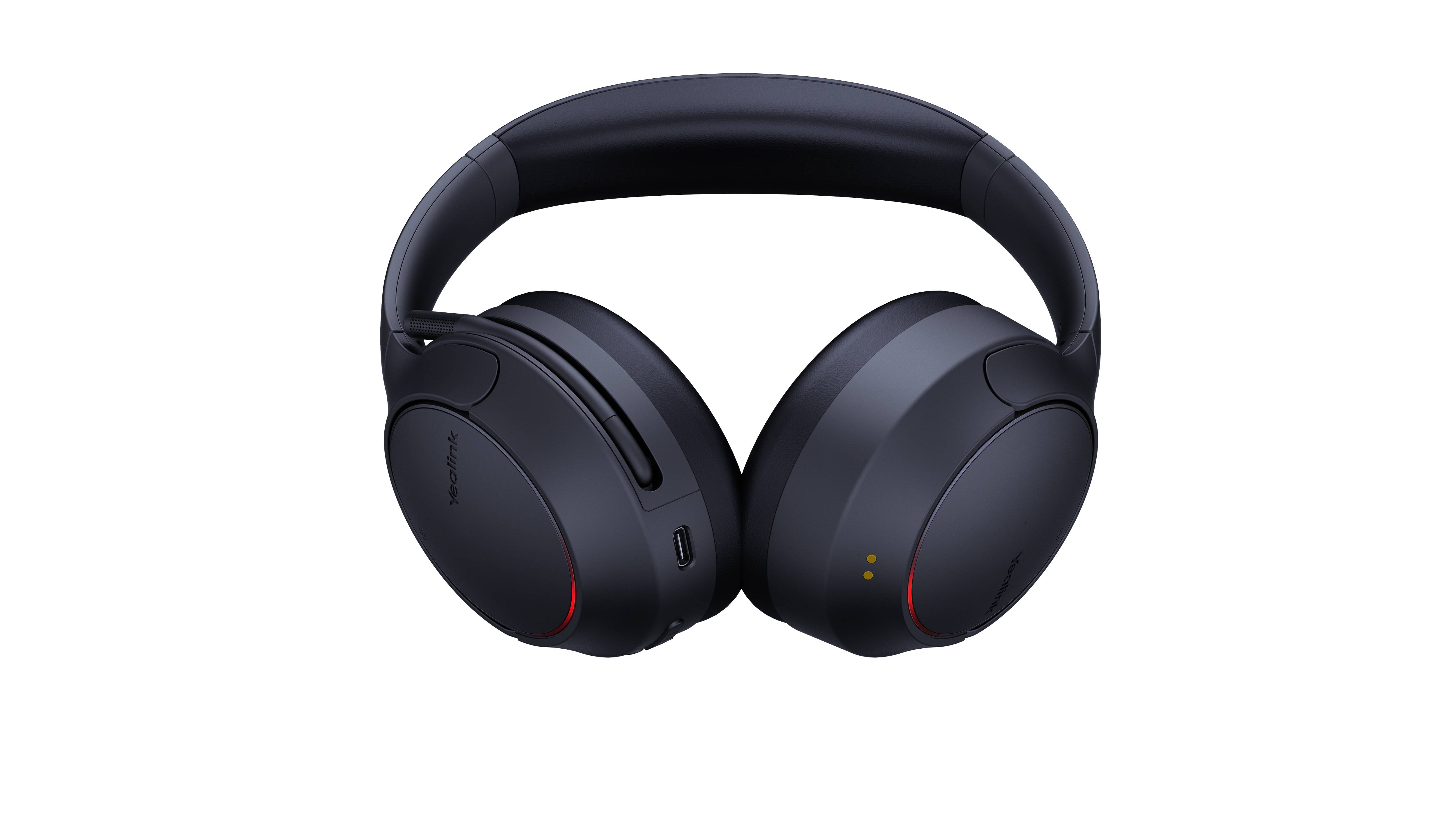 Schwarze Over-Ear-Kopfhörer mit gepolstertem Kopfbügel und großen Ohrmuscheln, gezeigt auf dunklem Hintergrund.