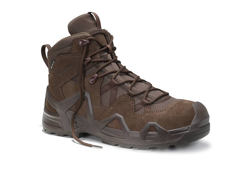Ein braunes Wanderstiefel mit robustem Profil, bestehend aus strapazierfähigem Leder und Stoffkonstruktion, Schnürsenkeln sowie verstärkter Zehen- und Fersenpartie für die Verwendung im Freien.