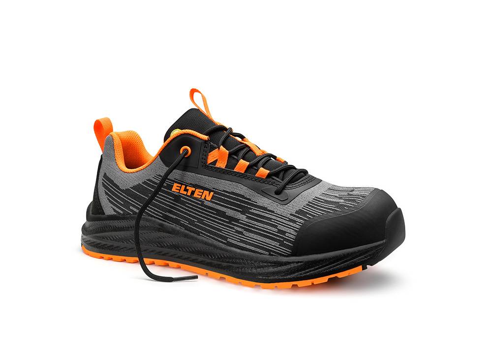 Ein schwarz-grauer Sportschuh mit orangefarbenen Akzenten und der Aufschrift „Elten