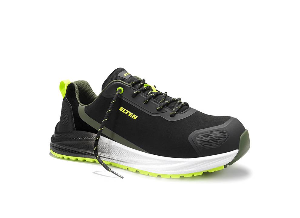 Ein schwarzer und grüner Sportschuh der Marke 