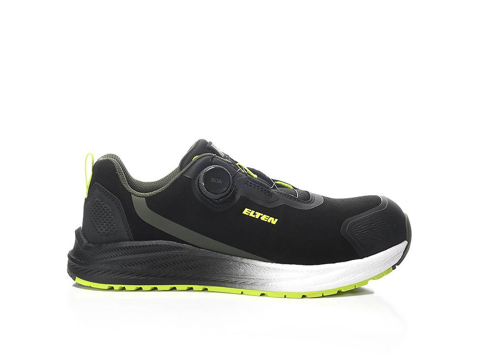 Ein schwarz-grüner Sportschuh mit neongrüner Sohle und 