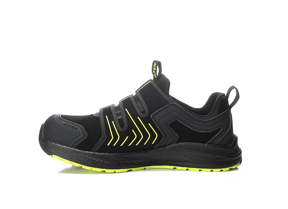 Ein schwarzer Sportschuh mit neongrünen Akzenten, mit einer robusten Sohle und Klettverschlussbändern. Das Design deutet auf Langlebigkeit und sportiven Stil hin.