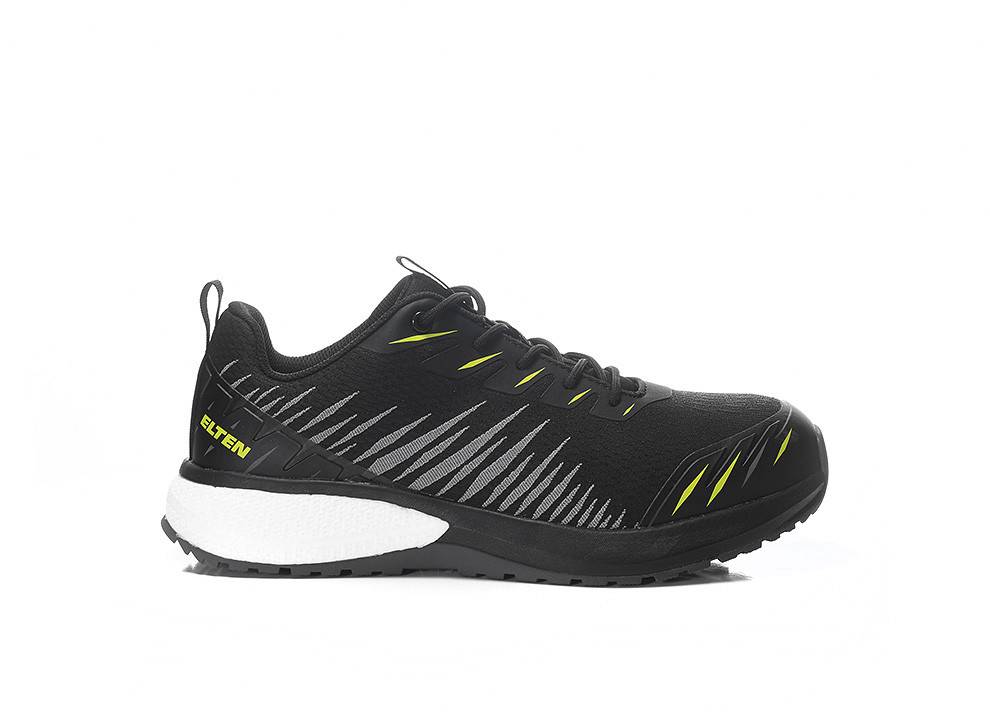 Ein schwarz-weißer Sneaker mit gelben Akzenten und „ELTEN