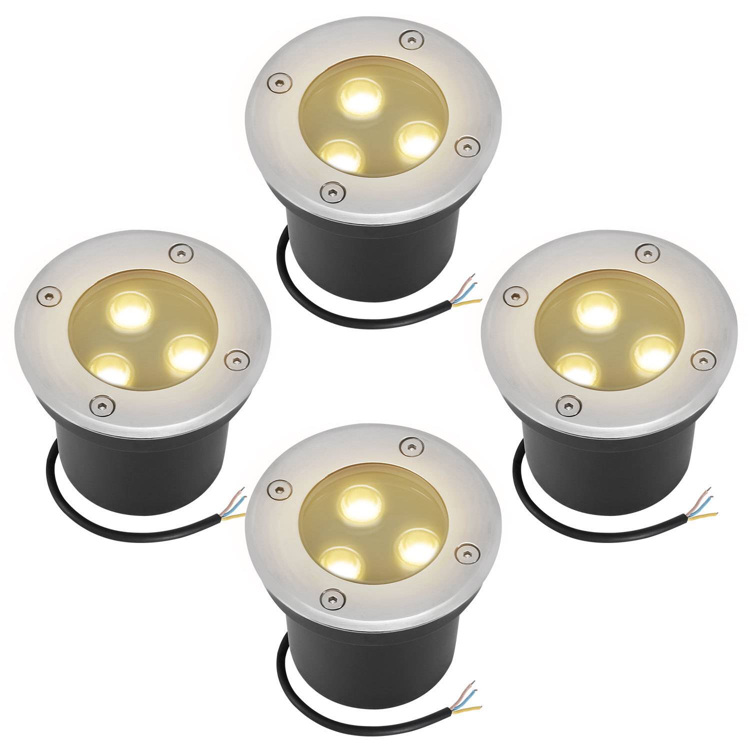 Vier runde LED-Bodenleuchten mit Metallrahmen und leuchtenden Glühbirnen, jeweils mit Verkabelung zur Installation ausgestattet.