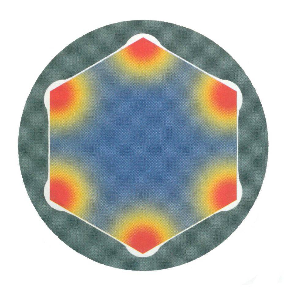 Ein sechseckiges Muster mit roten und gelben Flecken an jeder Ecke, das zur Mitte hin in Blau übergeht, auf einem dunklen Hintergrund.