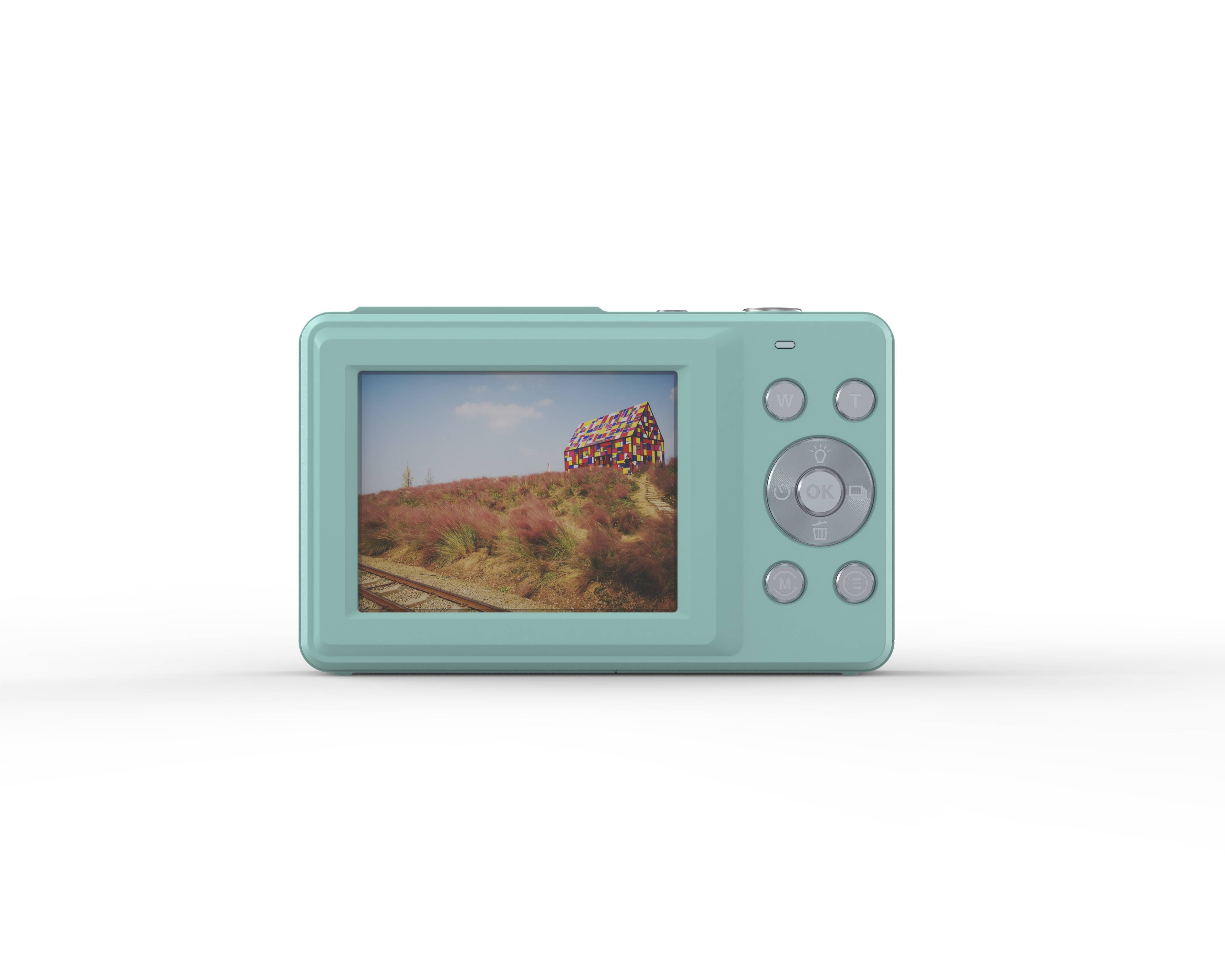 Eine mintgrüne Digitalkamera zeigt ein Display mit einem Foto eines farbenfrohen Hauses in einem Feld neben einem Eisenbahngleis.